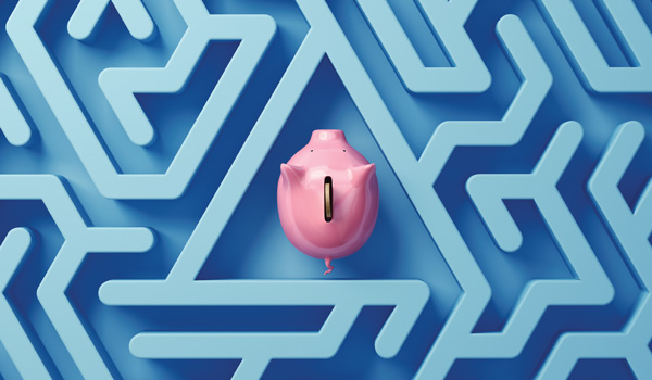 An overhead view of a piggy bank in the middle of a maze