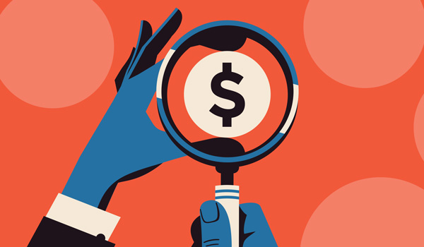 Looking at a dollar sign through the lens of a magnifying glass