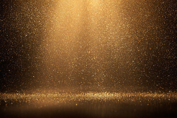 Glittering gold particles raining down